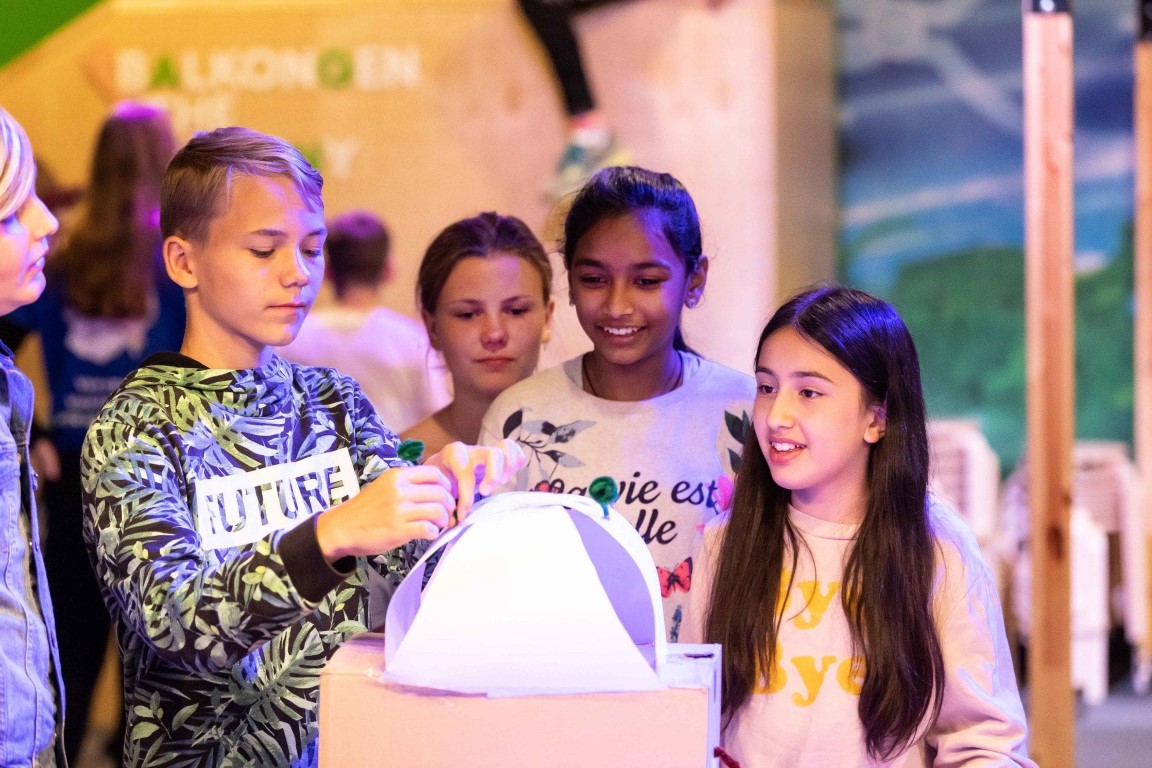 kids making a paper iglo